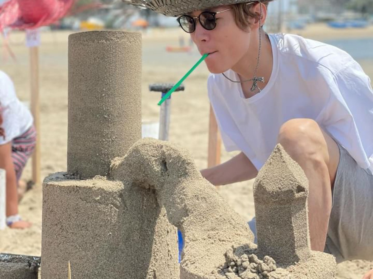 a person sitting at a beach