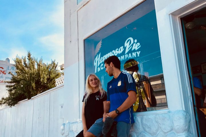 a man standing in front of a building