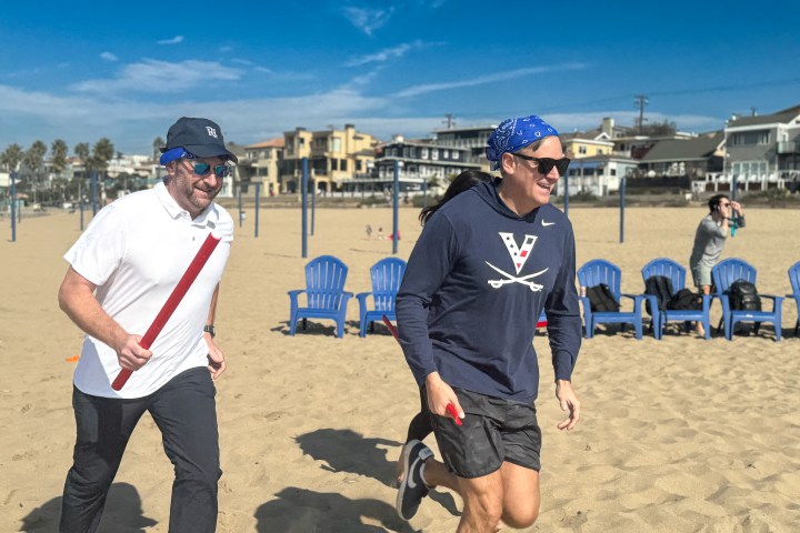 running to team building on the beach