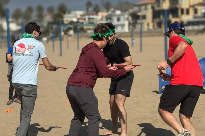 guests playing a team building game on the beach