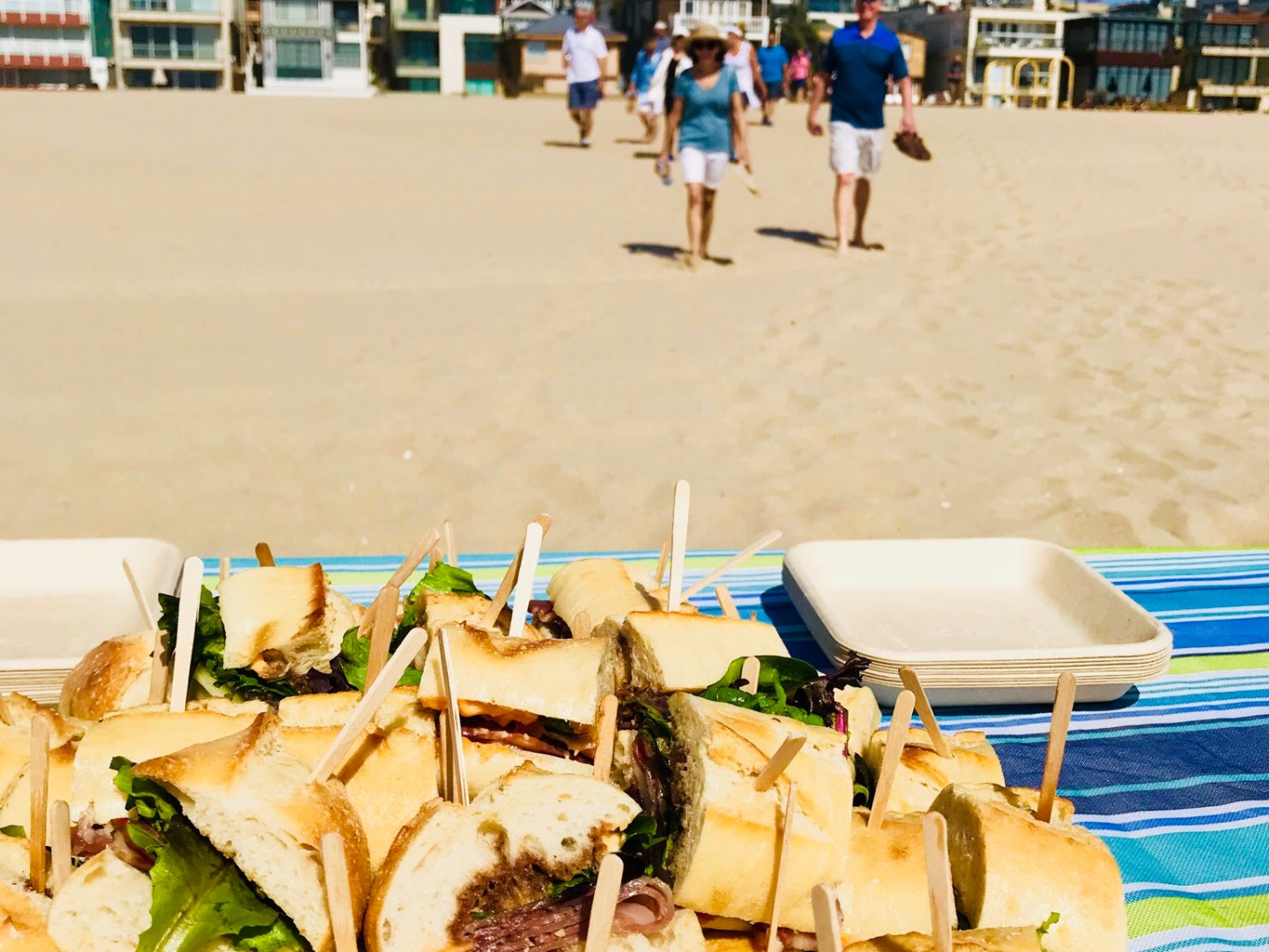 a sandwich cut in half on a beach