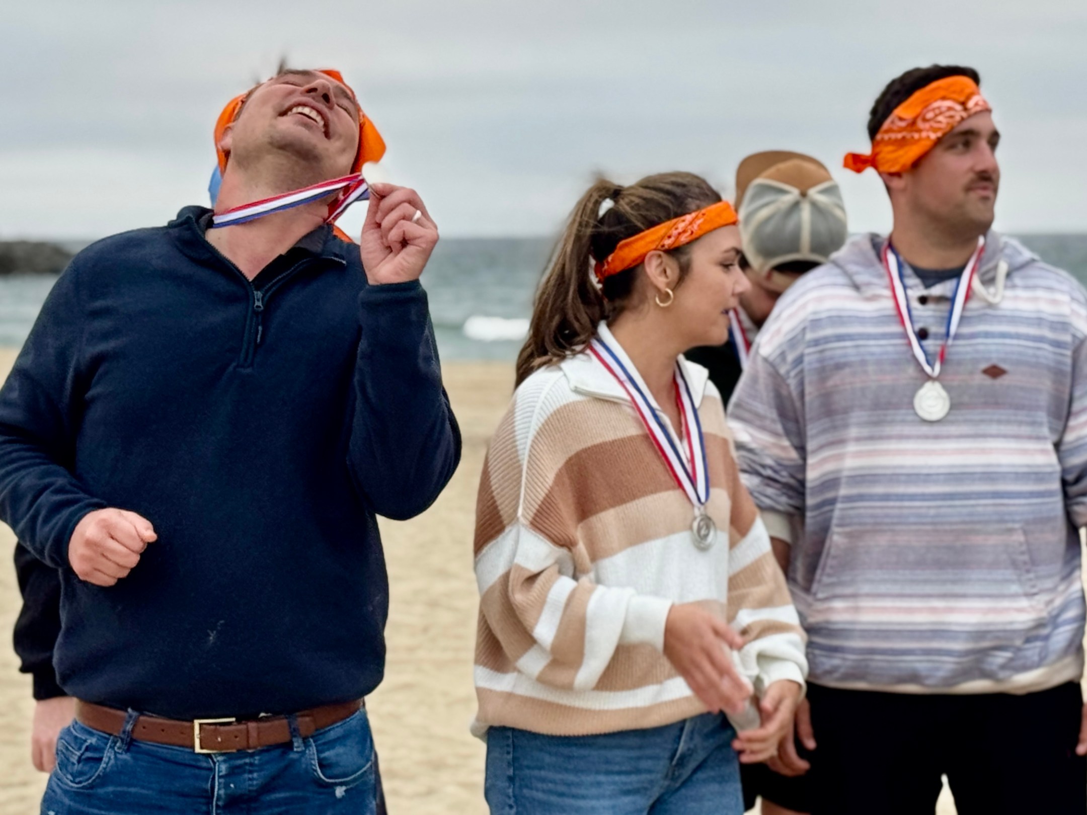 a group of people standing around each other