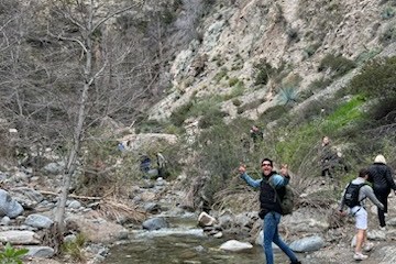 a group of people on a rocky hill