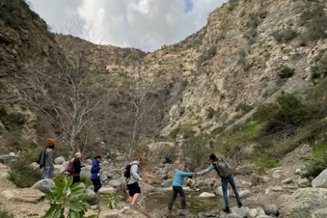 a group of people on a rock