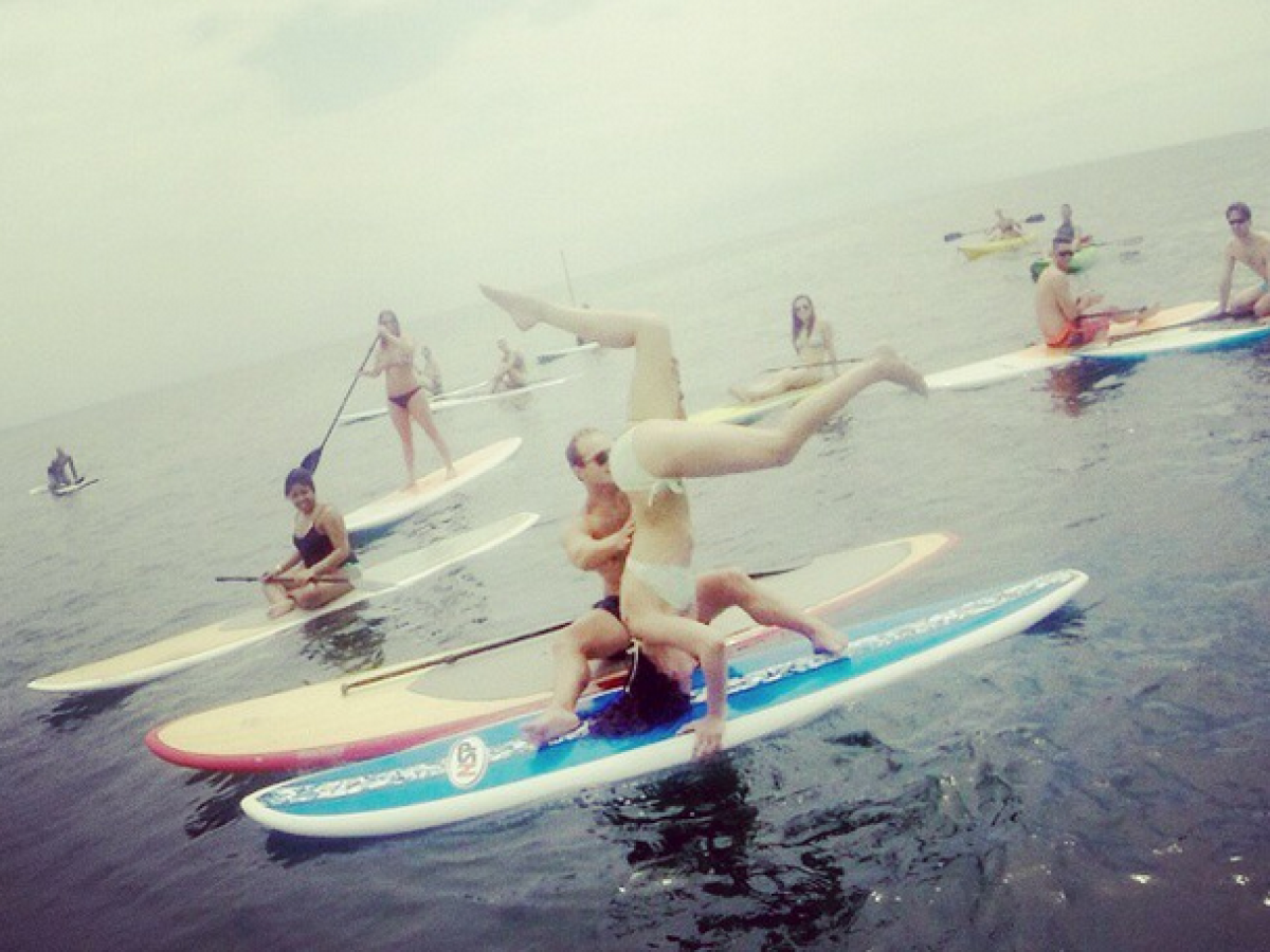 a group of people riding on the back of a boat