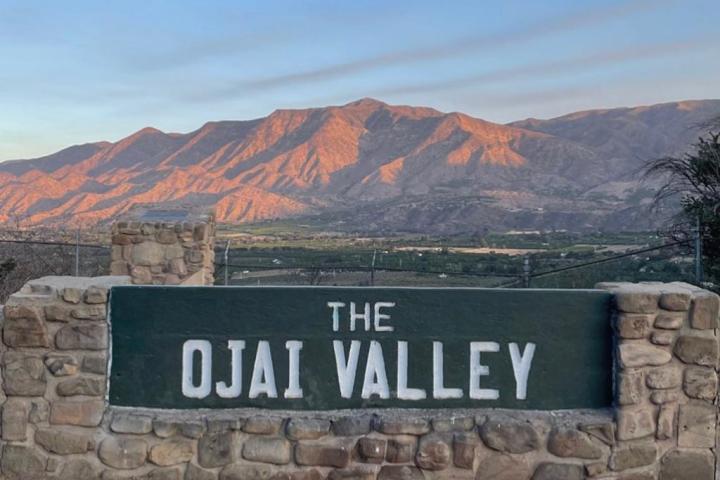 a sign on the side of a mountain