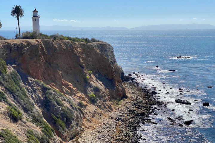 a body of water with a mountain in the background