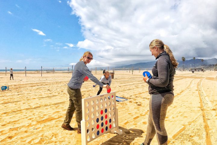 a man and a woman standing on a beach