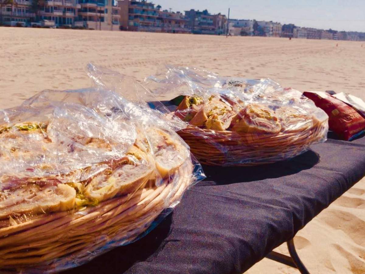 food on a table on the beach of LA