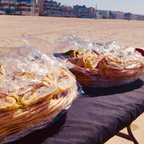 food on a table on the beach of LA