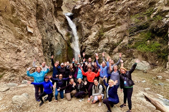 a group of people on a rocky hill