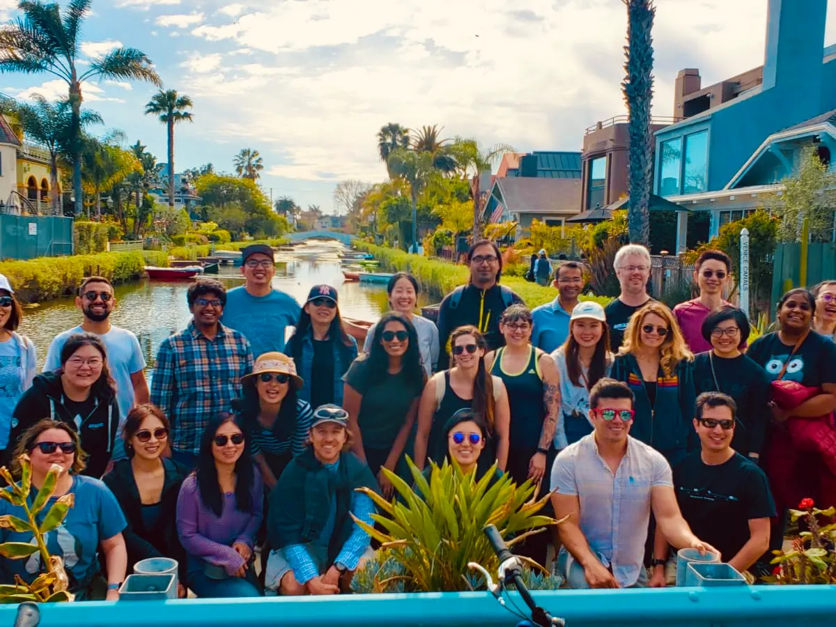 a group of people posing for a photo on a tour of the venice canals los angeles