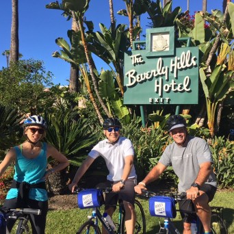 a couple of people that are standing in the grass
