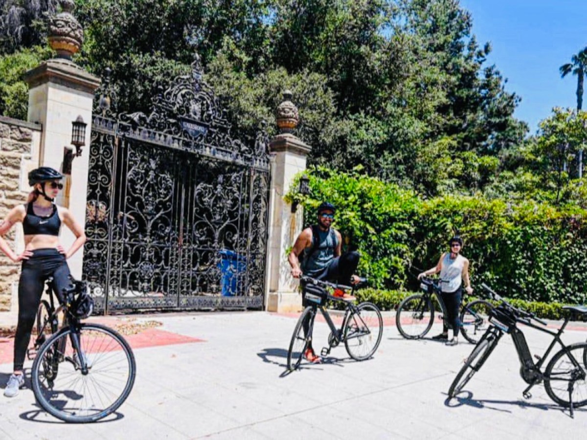 a group of people riding on bicycles in beverly hills