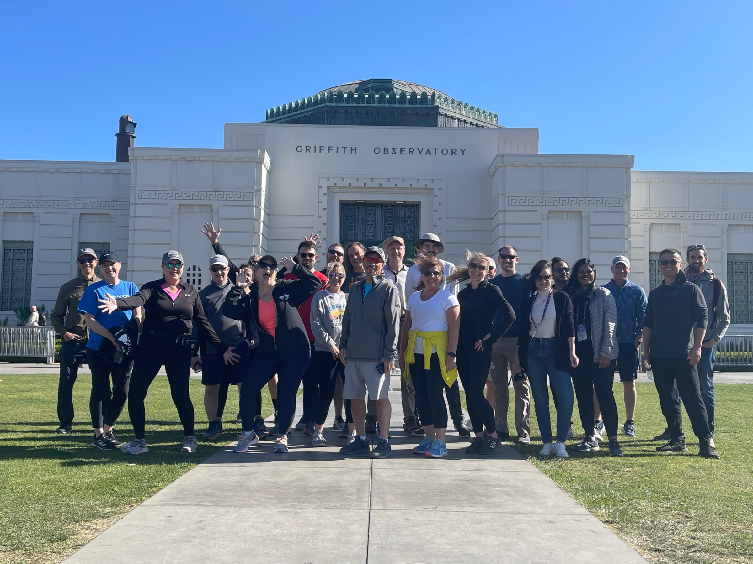 a group of people standing in front of a building