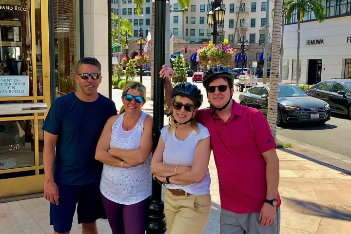 Robert Rey et al. standing in front of a building