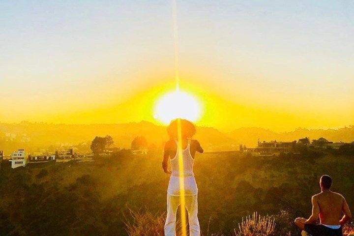 The sun rises on a hiker in Runyon Canyon Park in West Hollywood, California