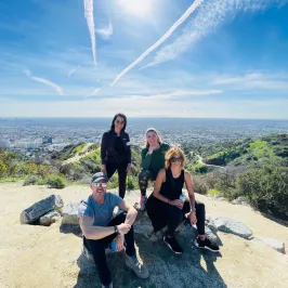 a group of people standing on top of a mountain