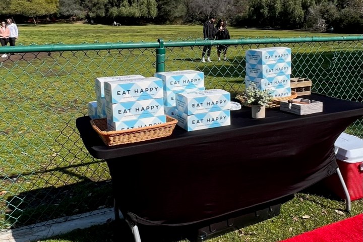 a group of lawn chairs sitting on top of a grass covered field