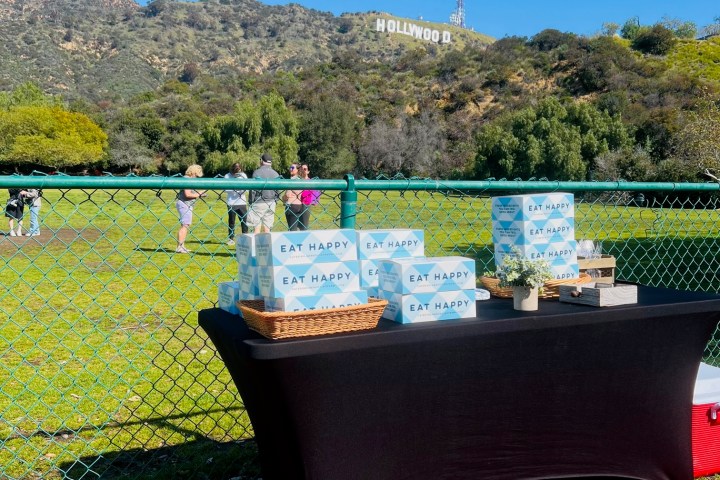 a boat sitting on top of a grass covered field