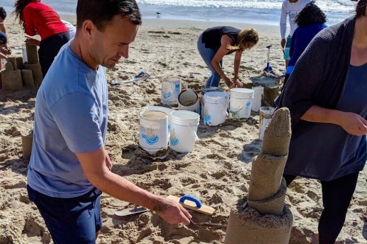 Man working on sandcastle