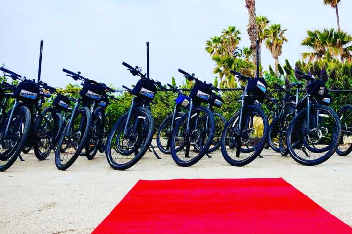 a row of parked motorcycles sitting on top of a rug