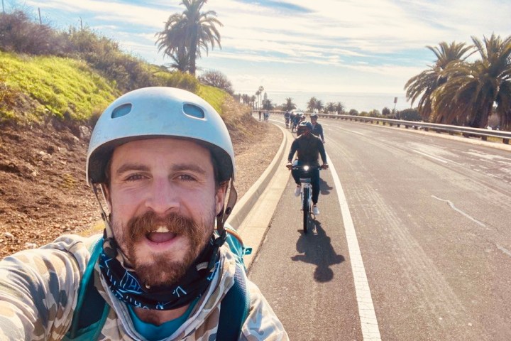 a man wearing a helmet posing for the camera