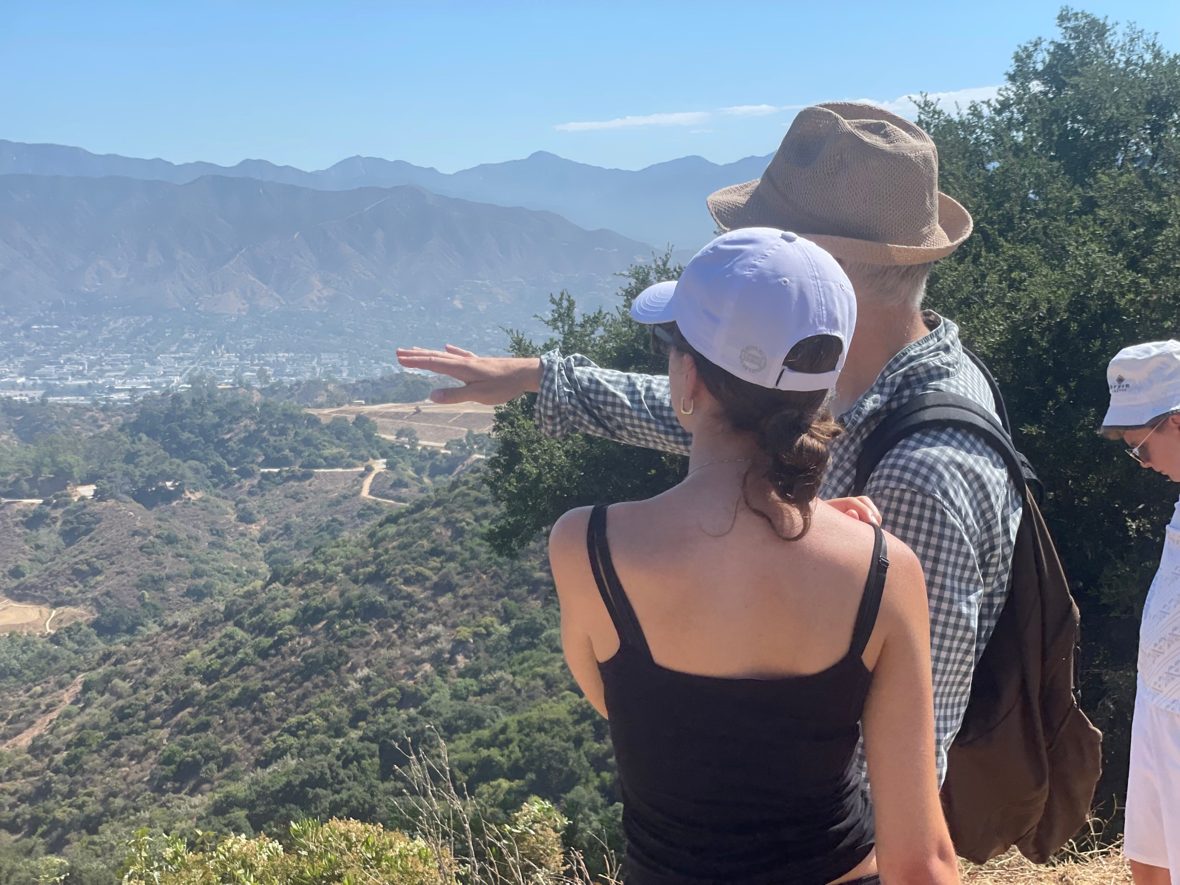 a person standing in front of a mountain