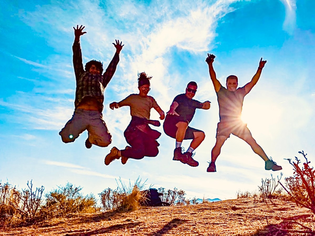 a group of people jumping in the air
