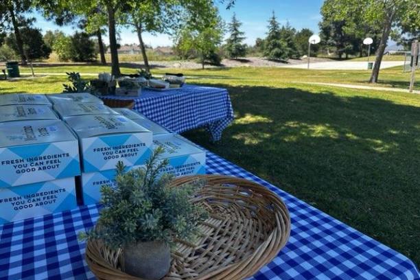a couple of lawn chairs sitting on top of a picnic table