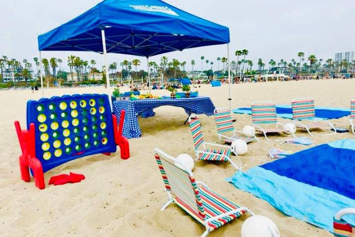 a group of lawn chairs sitting on top of a beach