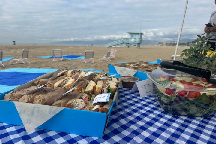 a table topped with a blue umbrella