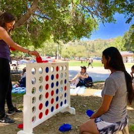friends playing large connect 4