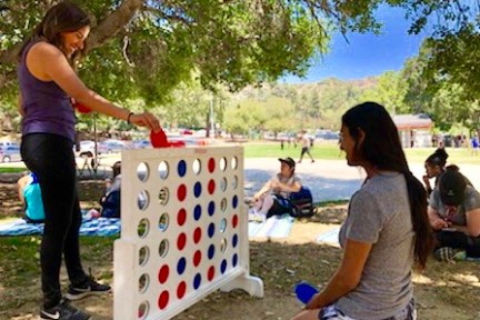 friends playing large connect 4