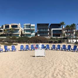 beach chairs lined up on beach