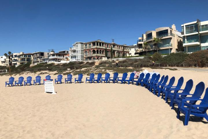 beach chairs lined up on beach
