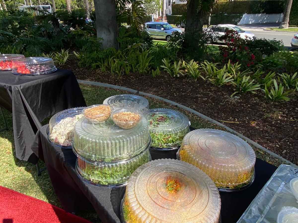 a group of lawn chairs sitting on top of a picnic table
