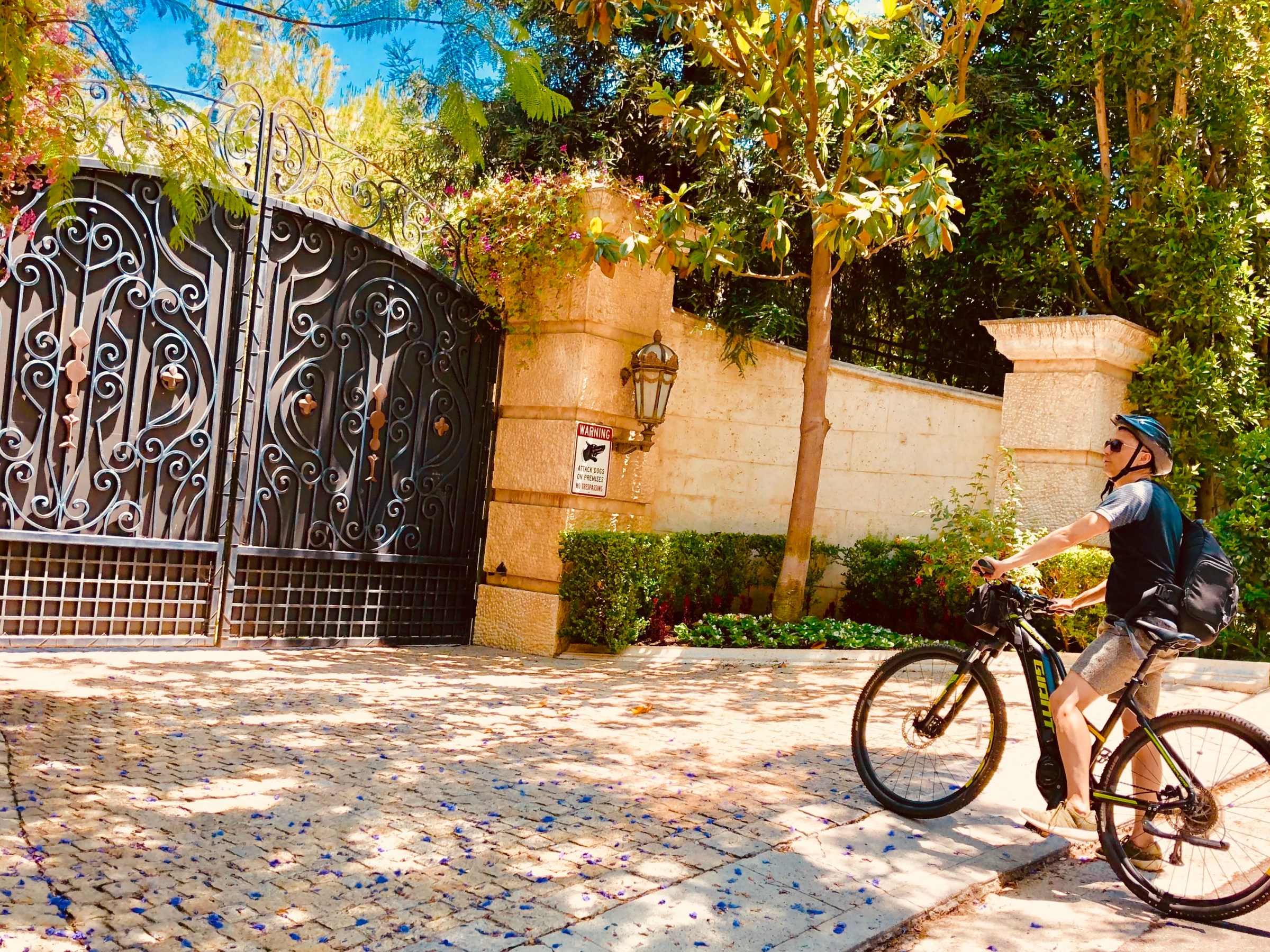 a person riding a bike down a dirt road