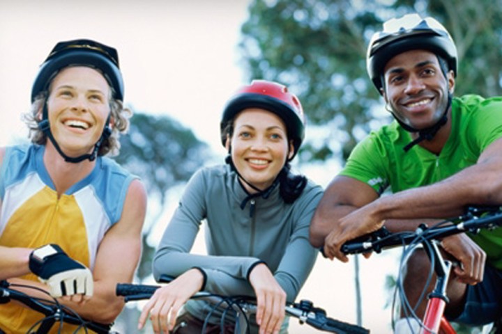 Rashid Johnson et al. riding on the back of a bicycle