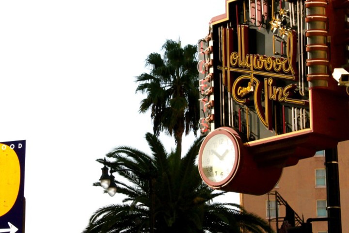 a sign on the side of a building hollywood and vine