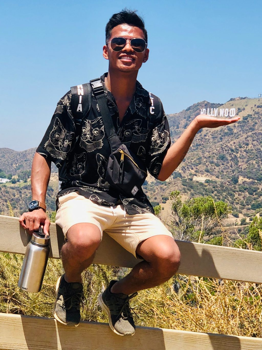 a person holding the hollywood sign in their hand on our griffith park hike
