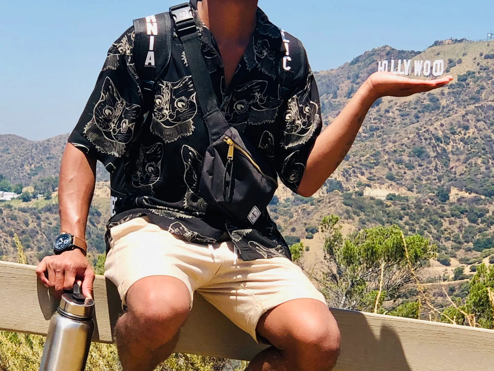a person holding the hollywood sign in their hand on our griffith park hike