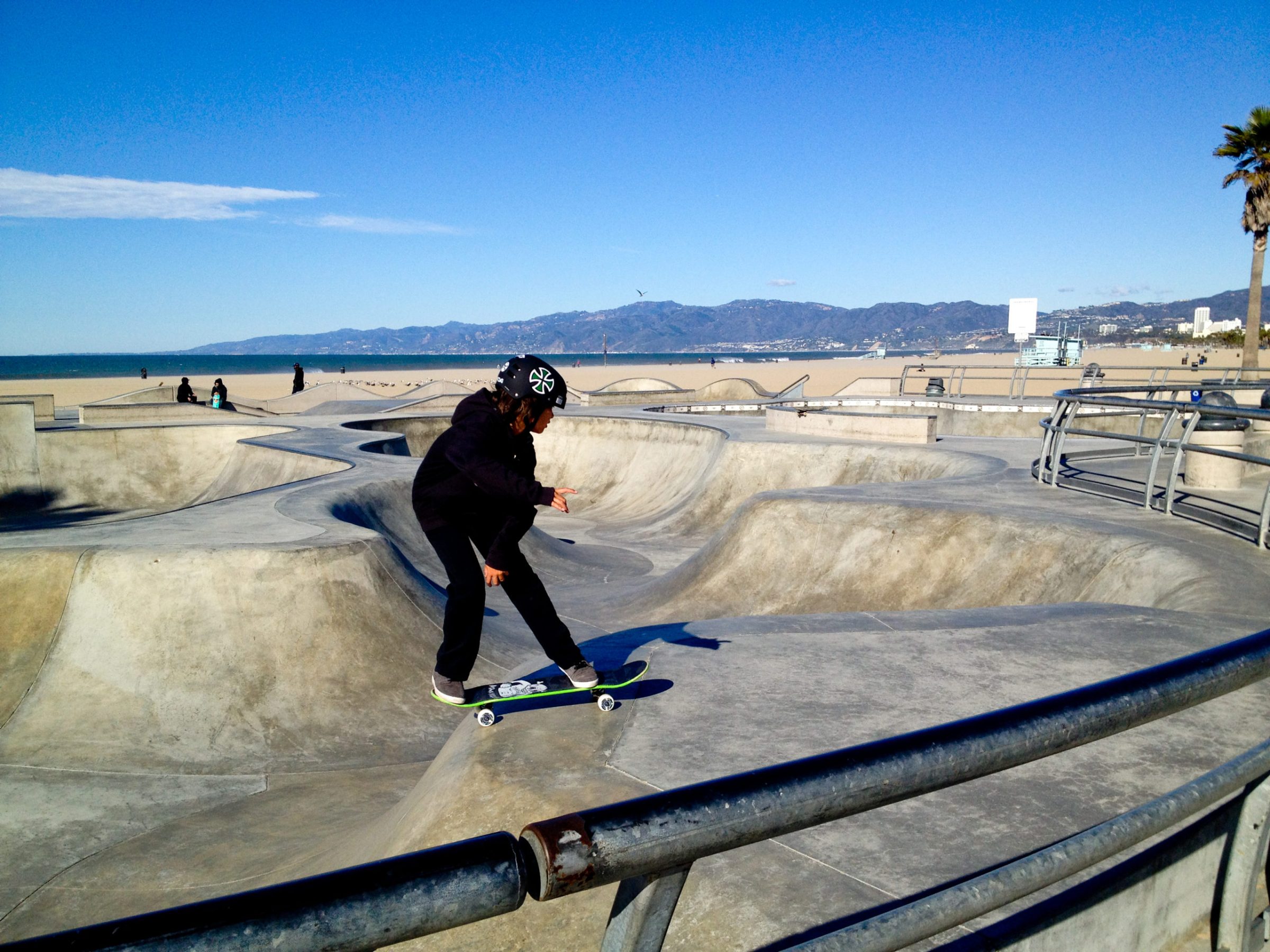 a boy in a venice skate park