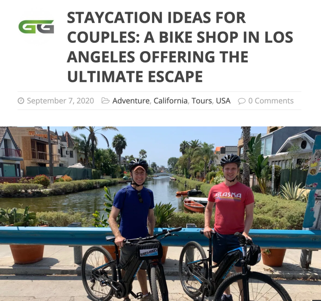 a group of people riding on the back of a bicycle