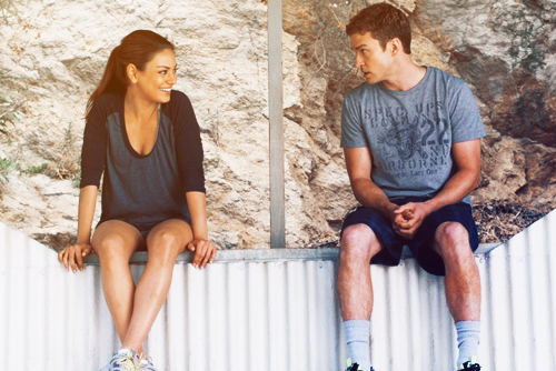 a couple of people that are sitting on a bench