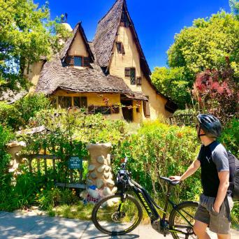 a man riding on the back of a bicycle
