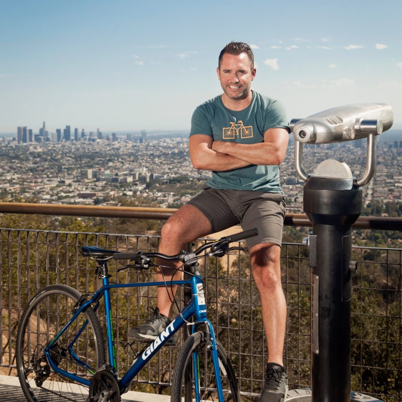 a man riding on the back of a bicycle
