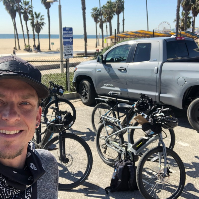 a man standing next to a car