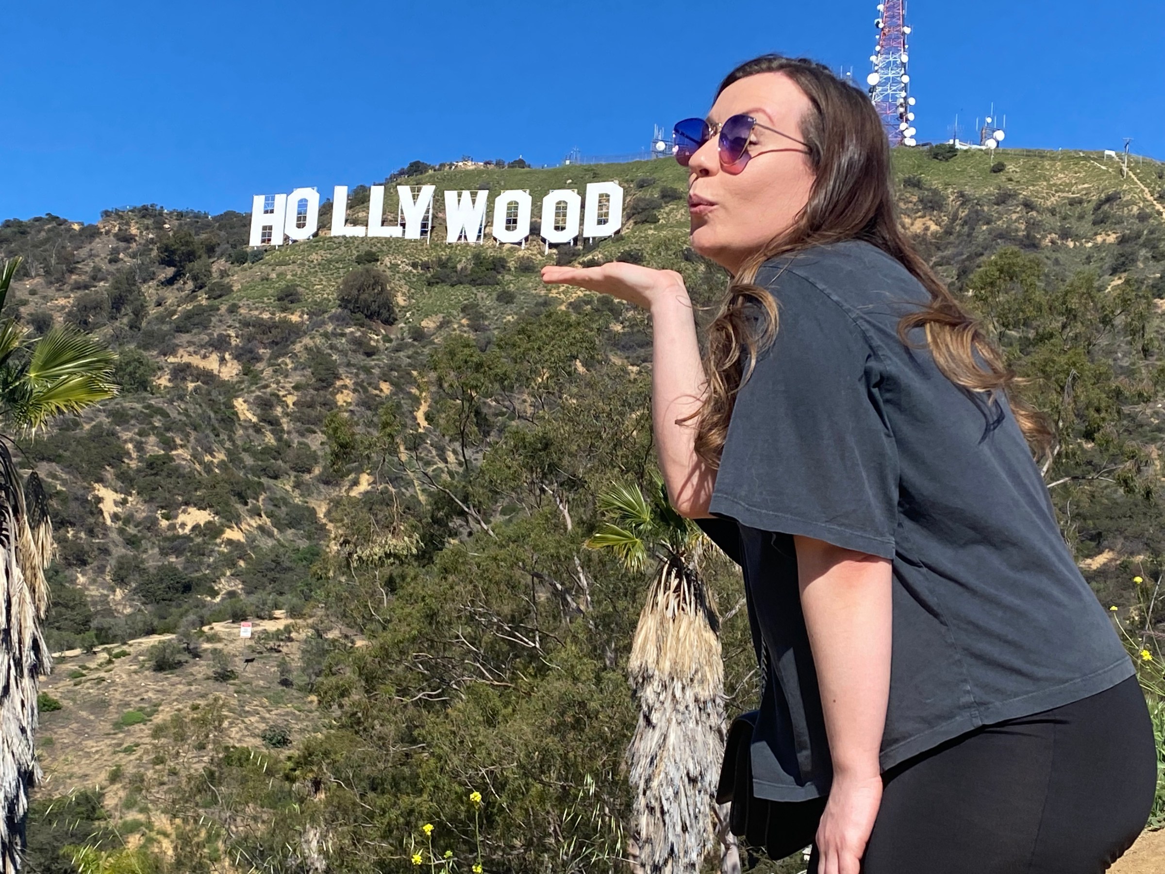 a person standing in front of a mountain