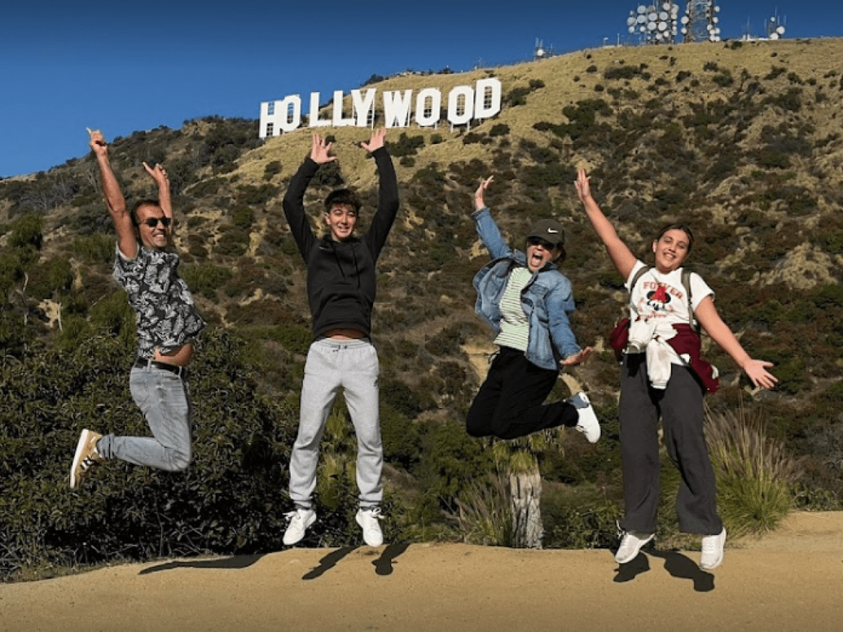 a group of people jumping in the air